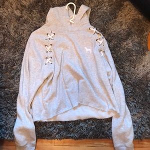 a grey cropped hoddie